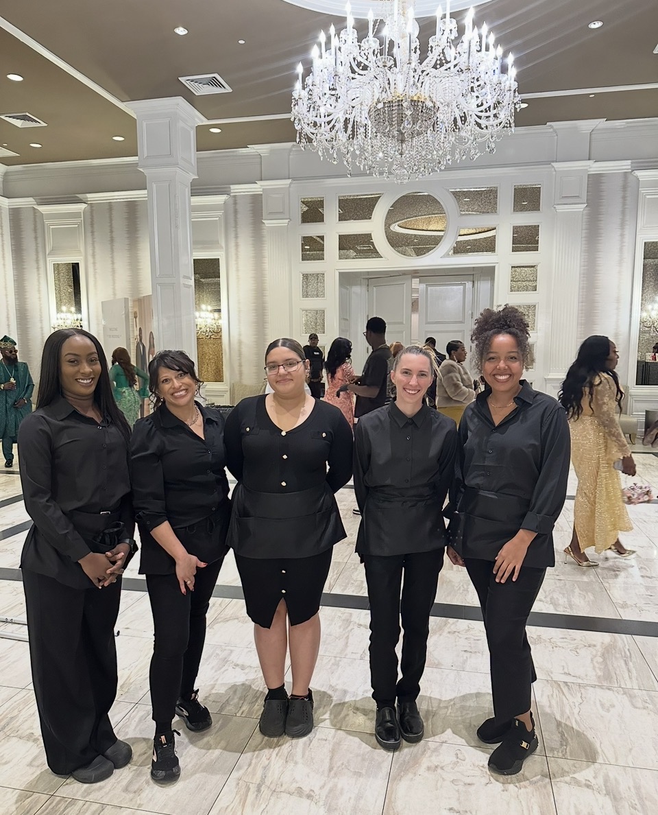 Raven's Reserve event staff team in black uniforms at a gala venue